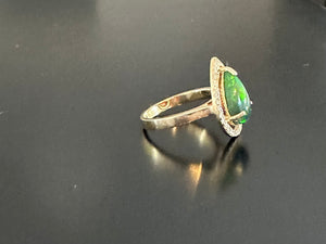 Women’s pear cut natural opal and diamond ring