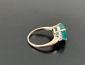 Natural Oval Emerald with diamonds yellow gold ring