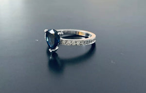 Pear cut sapphire and diamond white gold ring