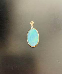 Women’s opal and diamond pendant