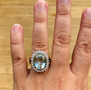 Large oval womens aquamarine and diamond ring