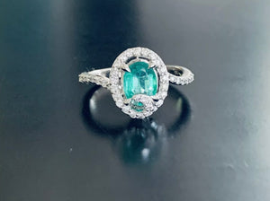 Women’s oval cut emerald and diamond ring
