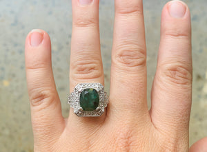 Women’s natural emerald and diamond shield ring